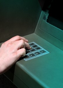 Person using ATM machine
