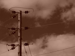 Sepia toned image showing powerlines/ phone lines, on wooden pole, high in the sky , holyoke, massachusetts